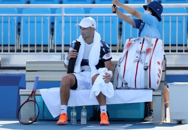 Liam Broady of Team Great Britain attempts to keep cool during his Men's Singles Third Round match against Jeremy Chardy of Team France on day five...