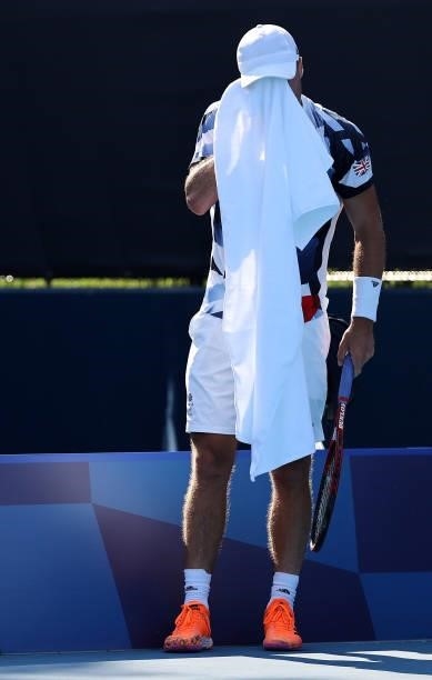 Liam Broady of Team Great Britain towels down between points during his Men's Singles Third Round match against Jeremy Chardy of Team France on day...