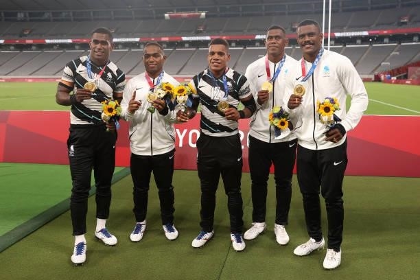 Aminiasi Tuimaba, Waisea Nacuqu, Napolioni Bolaca, Kalione Nasoko and Jiuta Wainiqolo pose with their gold medals after winnig the Rugby Sevens Men's...