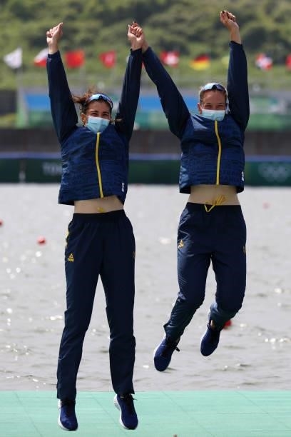 Gold medalists Ancuta Bodnar and Simona Radis of Team Romania celebrate during the medal ceremony for the Women's Double Sculls Final A on day five...