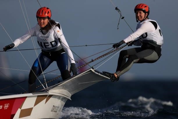 Annemiek Bekkering and Annette Duetz of Team Netherlands react as they win race 6 while competing in the Women's Skiff - 49er class on day five of...