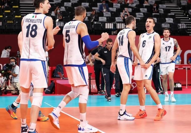 Players of Team Italy react after defeating Team Japan during the Men's Preliminary Round - Pool A volleyball on day five of the Tokyo 2020 Olympic...