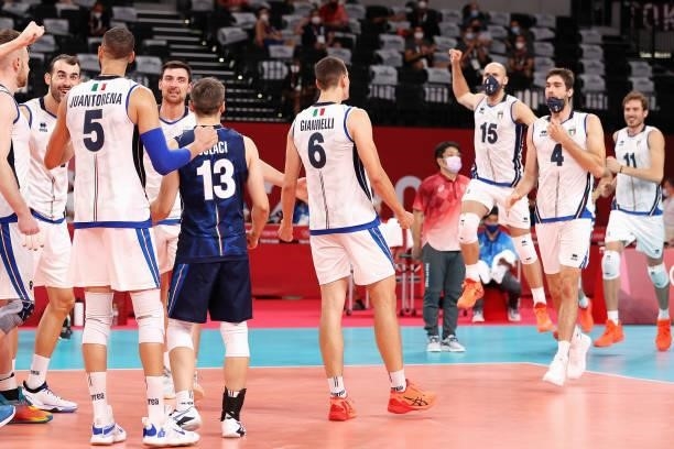 Players of Team Italy react after defeating Team Japan during the Men's Preliminary Round - Pool A volleyball on day five of the Tokyo 2020 Olympic...
