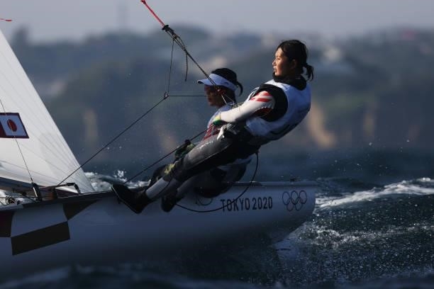 Ai Kondo Yoshida and Miho Yoshioka of Team Japan compete in the Women's 470 class on day five of the Tokyo 2020 Olympic Games at Enoshima Yacht...
