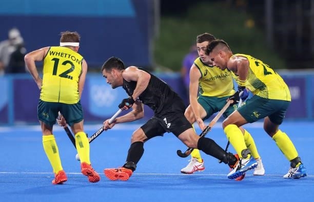 Nick Ross of Team New Zealand is pressured by Jacob Thomas Whetton and Tim Brand of Team Australia during the Men's Preliminary Pool A match between...