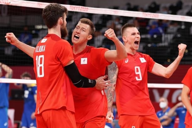 Ivan Iakovlev of Team ROC reacts with team mates against Team Brazil during the Men's Preliminary Round - Pool B volleyball on day five of the Tokyo...