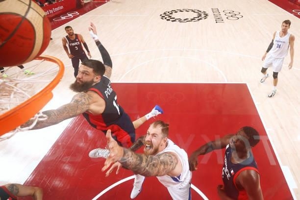 Patrik Auda of Team Czech Republic drives to the basket against Vincent Poirier of Team France during the second half of a Men's Preliminary Round...