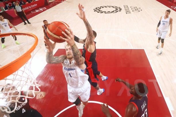 Patrik Auda of Team Czech Republic drives to the basket against Vincent Poirier of Team France during the second half of a Men's Preliminary Round...
