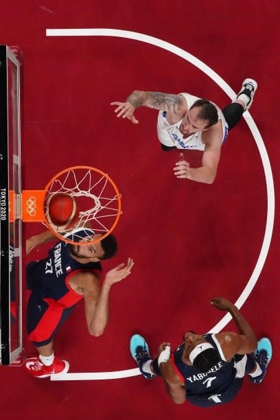Rudy Gobert of Team France watches his shot go into the basket as teammate Guerschon Yabusele and Ondrej Balvin of Team Czech Republic look on during...