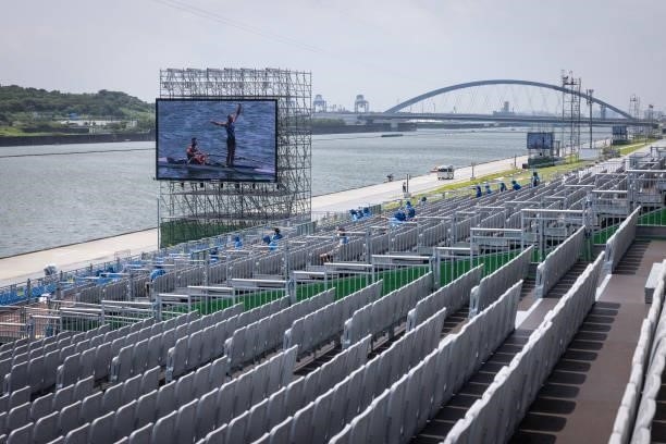 Giant television screen broadcasts the Lightweight Men's Double Sculls Semifinal A/B 1 to near-empty spectator stands on day five of the Tokyo 2020...