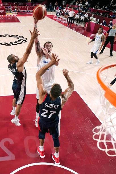 Ondrej Balvin of Team Czech Republic shoots over Nicolas Batum and Rudy Gobert of Team France during the first half of a Men's Preliminary Round...