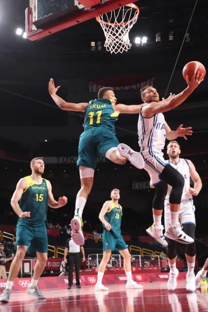 Stefano Tonut of Team Italy drives to the basket against Dante Exum of Team Australia during the first half of a Men's Preliminary Round Group B game...