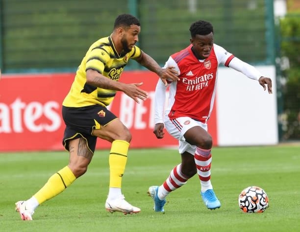 Eddie Nketiah of Arsenal takes on Josh King of Watford during the pre season friendly match between Arsenal and Watford at London Colney on July 28,...
