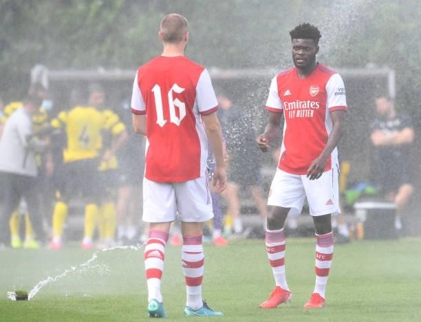 Thomas Partey chats to Rob Holding of Arsenal at half time during the pre season friendly match between Arsenal and Watford at London Colney on July...