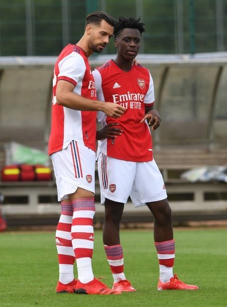 Pablo Mari chats to Albert Sambi Lokonga of Arsenal at half time during the pre season friendly match between Arsenal and Watford at London Colney on...