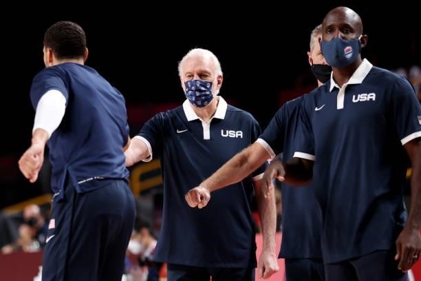 Head Coach of Team United States Gregg Popovich and his coaching staff fist bumps his players before their Men's Preliminary Round Group A game...