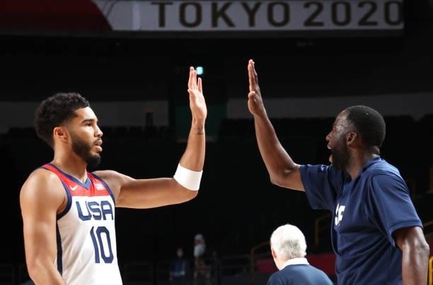 Jayson Tatum of Team United States high fives teammates while playing against Islamic Republic of Iran during the Men's Preliminary Round Group A...