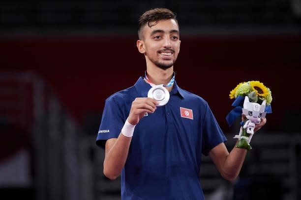 Silver medalist Mohamed Khalil Jendoubi of Team Tunisia poses with the silver medal for the Men's -58kg Taekwondo Gold Medal contest on day one of...