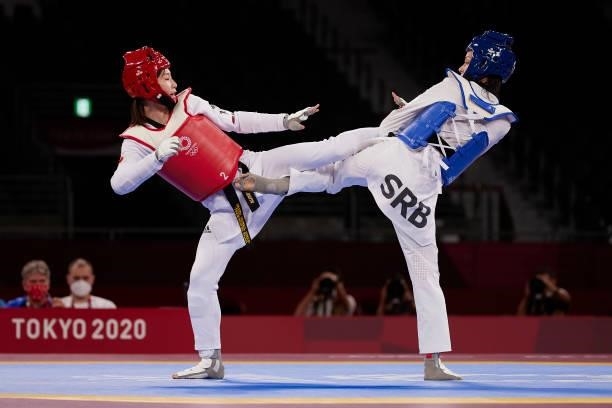 Miyu Yamada of Team Japan competes against Tijana Bogdanovic of Team Serbia during the Women's -49kg Taekwondo Bronze Medal contest on day one of the...