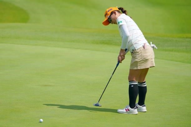Chie Arimura of Japan holes the birdie putt on the 5th green during the first round of Rakuten Super Ladies at Tokyu Grand Oak Golf Club on July 29,...