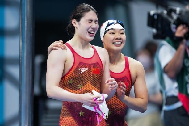 Gold medalist Zhang Yufei of Team China celebrates with team mate Yu Liyan after the Women's 200m Butterfly Final on day six of the Tokyo 2020...