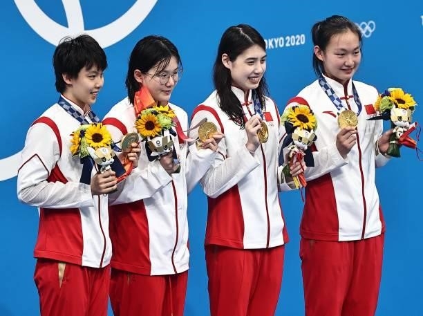 Gold medalists Yang Junxuan, Tang Muhan, Zhang Yufei and Li Bingjie of China celebrate during the medal ceremony for the Women's 4 x 200 m Freestyle...