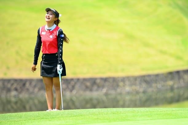 Reika Usui of Japan reacts after her approach shot onto the 8th green during the first round of Rakuten Super Ladies at Tokyu Grand Oak Golf Club on...