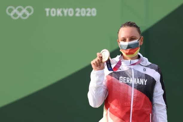 Bronze medalist Andrea Herzog of Team Germany celebrates during the medal ceremony following the Women's Canoe Slalom Final on day six of the Tokyo...
