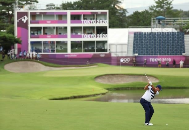 Patrick Reed of Team United States plays a shot on the 18th hole during the first round of the Men's Individual Stroke Play on day six of the Tokyo...