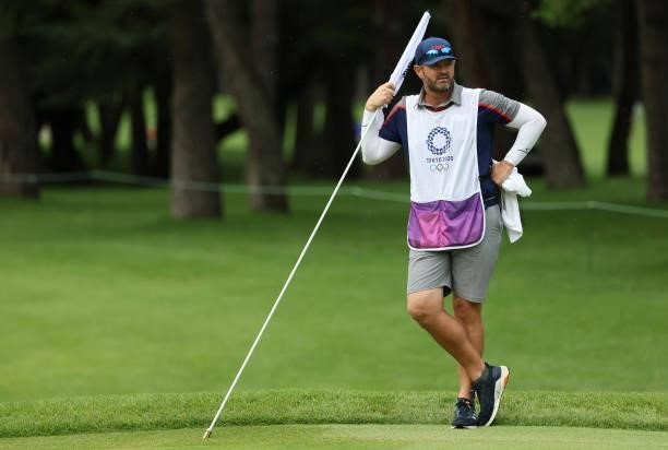 Jakovac, caddie for Xander Schauffele of Team United States, looks on during the first round of the Men's Individual Stroke Play on day six of the...