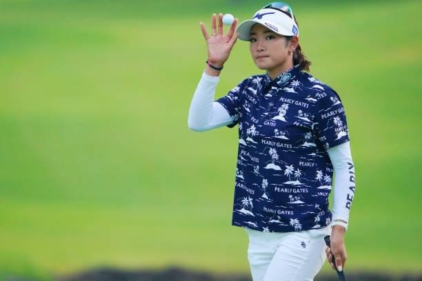 Erika Hara of Japan acknowledges fans after holing out on the 18th green during the first round of Rakuten Super Ladies at Tokyu Grand Oak Golf Club...