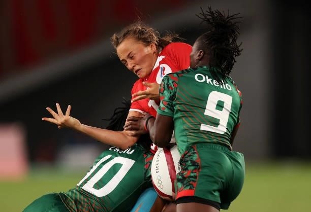 Anna Baranchuk of Team ROC is tackled by Grace Okulu and Janet Okello of Team Kenya in the Women’s pool A match between Team ROC and Team Kenya...
