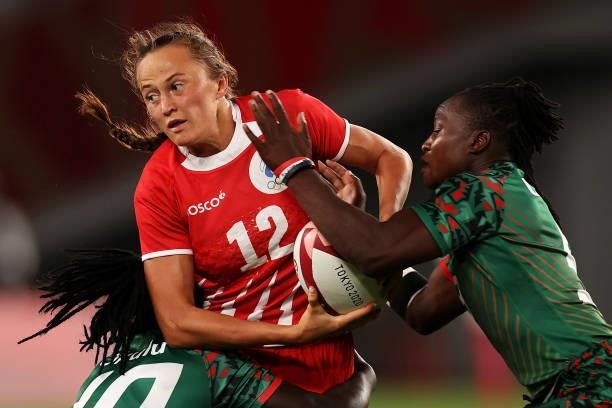 Anna Baranchuk of Team ROC is tackled by Grace Okulu and Janet Okello of Team Kenya in the Women’s pool A match between Team ROC and Team Kenya...