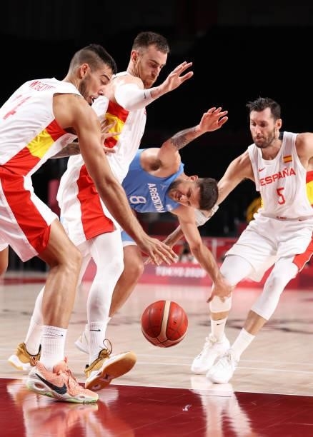 Nicolas Laprovittola of Team Argentina fights for possession of the ball with Willy Hernangomez, Rudy Fernandez and Victor Claver of Team Spain...