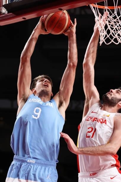 Nicolas Brussino of Team Argentina drives to the basket against Alejandro Abrines Redondo of Team Spain during the second half of a Men's Preliminary...