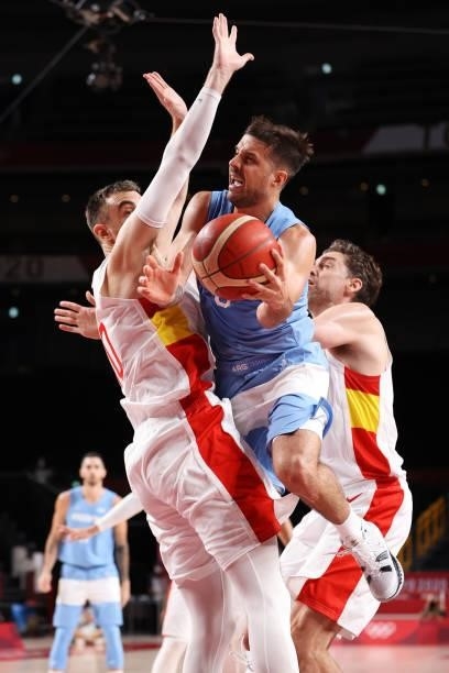 Nicolas Laprovittola of Team Argentina passes the ball around Victor Claver of Team Spain during the second half of a Men's Preliminary Round Group C...