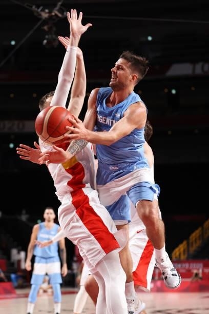 Nicolas Laprovittola of Team Argentina passes the ball around Victor Claver of Team Spain during the second half of a Men's Preliminary Round Group C...