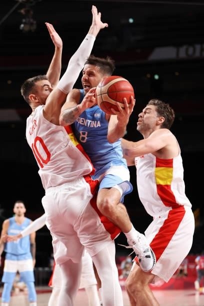 Nicolas Laprovittola of Team Argentina drives to the basket against Victor Claver of Team Spain during the second half of a Men's Preliminary Round...