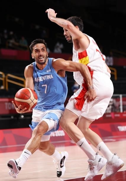 Facundo Campazzo of Team Argentina drives to the basket Alejandro Abrines Redondo of Team Spain during the second half of a Men's Preliminary Round...
