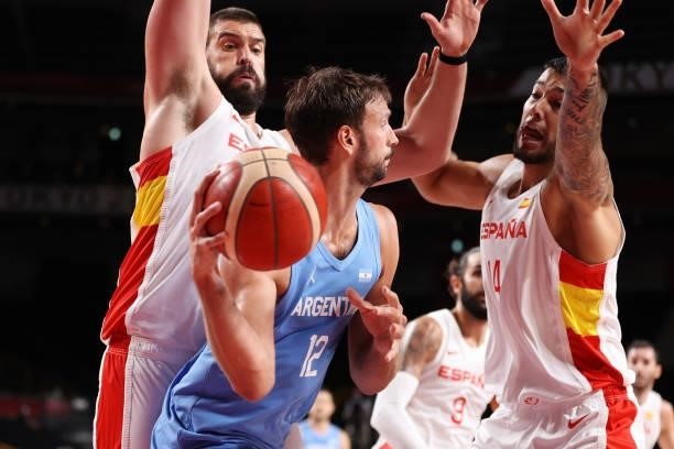 Marcos Delia of Team Argentina passes the ball as he is pressured by Marc Gasol and Willy Hernangomez of Team Spain during the second half of a Men's...