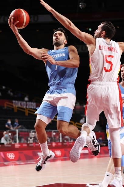 Facundo Campazzo of Team Argentina drives to the basket against Rudy Fernandez of Team Spain during the second half of a Men's Preliminary Round...