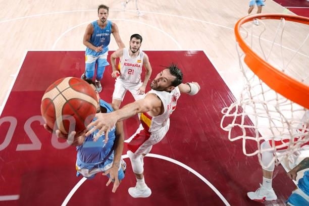 Rudy Fernandez of Team Spain attempts to block a shot by Facundo Campazzo of Team Argentina as he drives to the basket during the second half of a...