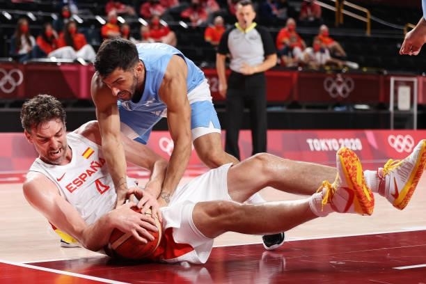 Pau Gasol of Team Spain and Facundo Campazzo of Team Argentina fight for possesion of the ball during the first half of a Men's Preliminary Round...