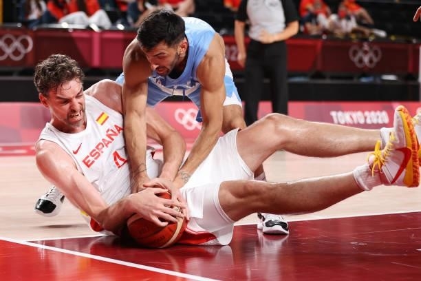 Pau Gasol of Team Spain and Facundo Campazzo of Team Argentina fight for possesion of the ball during the first half of a Men's Preliminary Round...