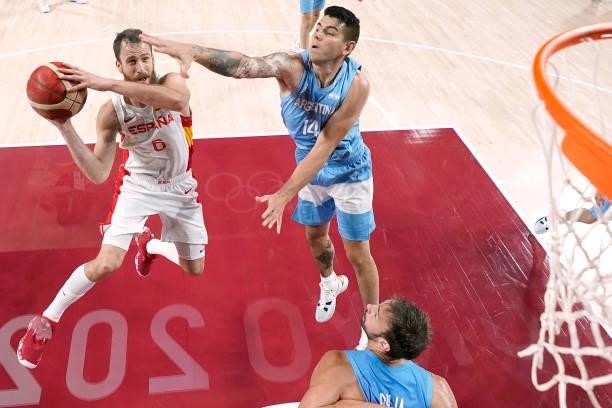 Sergio Rodriguez of Team Spain drives to the basket against Gabriel Deck of Team Argentina during the first half of a Men's Preliminary Round Group C...