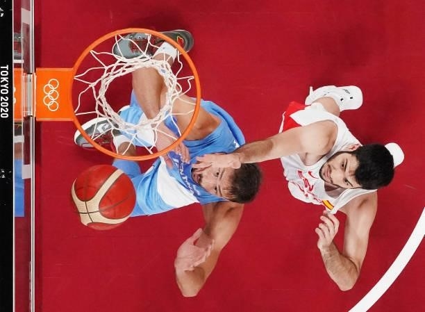 Marcos Delia of Team Argentina and Alejandro Abrines Redondo of Team Spain jump for possession of a rebound during the first half of a Men's...