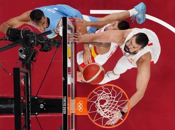 Luis Scola of Team Argentina drives to the basket against Willy Hernangomez and Marc Gasol of Team Spain and during the first half of a Men's...