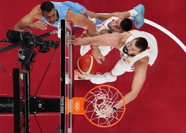 Luis Scola of Team Argentina drives to the basket against Willy Hernangomez and Marc Gasol of Team Spain and during the first half of a Men's...