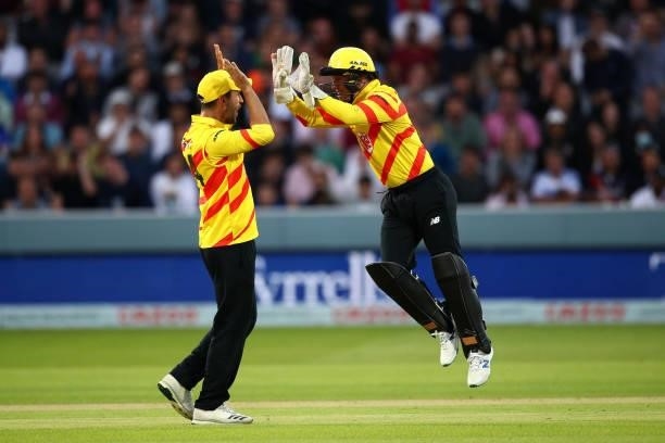 Tom Moores of Trent Rockets celebrates taking the wicket of Ravi Bopara of London Spirit with Lewis Gregory during The Hundred match between London...