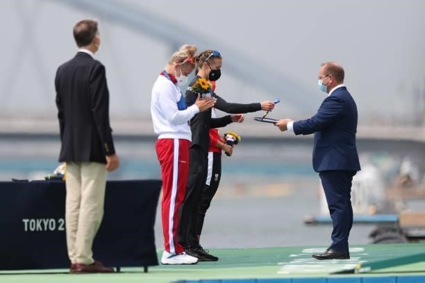 Gold medalist Emma Twigg of Team New Zealand receives her medal during the medal ceremony for the Women's Single Sculls Final A on day seven of the...